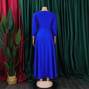Detail view of the back of a blue A-line dress featuring a hidden zipper and tie waist