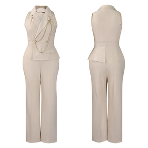 Detail view of beige sleeveless jumpsuit with lapel collar and golden chain accents