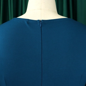 Detailed view of the invisible rear zipper and crew neckline on a navy blue dress