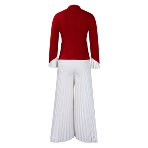 Detail of red blazer with white pleated flared sleeves and matching wide-leg trousers