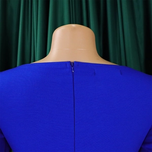 Detail of invisible back zipper on royal blue dress with textured fabric detail