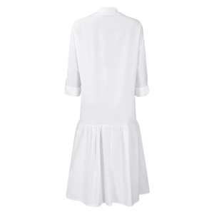 Rear view of white loose midi dress featuring ruffled hem and rolled sleeve details