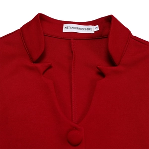 Detail view of the V-neck collar and fabric texture of the red two-piece suit outfit