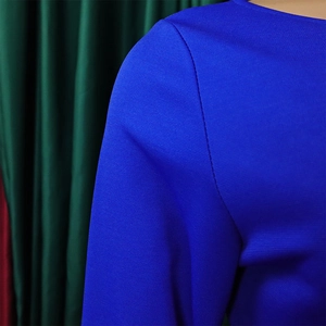 Detail of royal blue ribbed knit dress showing high-quality stitching on shoulder seam