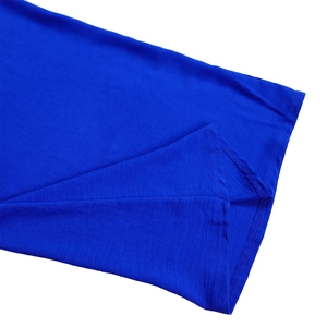 Detail view of high-quality double-needle stitching on navy blue long sleeve jumpsuit cuff