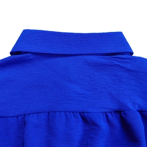 Detail of the royal blue turnover collar with fine woven fabric texture and stitching