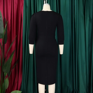 Back view of black slim fit midi dress with hidden zipper and stylish puff sleeves