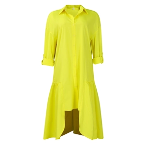 Detail of high-low hem and button-up closure on neon green long-sleeve midi dress