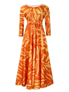 Detail of the yellow abstract floral print and fabric texture on a maxi dress