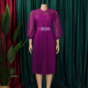Detail of dark purple lace bodice with lantern sleeves and pleated skirt texture