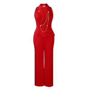 Detail view of red sleeveless jumpsuit with golden buttons and metal chain decor