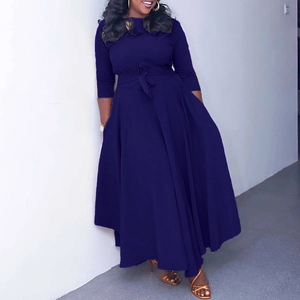 Detail view of the elegant deep purple maxi dress featuring a cinched waist and pleated skirt