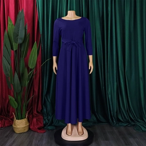 Detail of elegant long sleeve midi dress featuring high waist bow tie and pleated A-line skirt