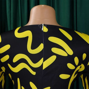 Detail view of the back invisible zipper on a short sleeve African print dress