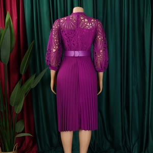 Detail of violet lace hollow sleeve and pleated skirt back view with matching belt