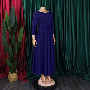 Detail of dark purple long sleeve maxi dress with elegant self-tie bow waistband