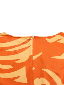 Detailed view of the high-quality invisible zipper on a vibrant abstract print dress