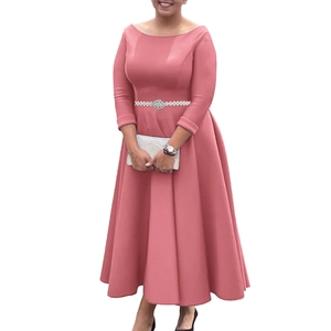 Detail of elegant dusty pink evening dress with a pearl and gemstone embellished belt