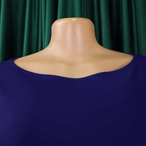 Detailed view of the round neckline and knitted texture of the royal blue A-line dress