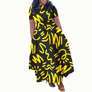 Detail of plus size black dress featuring bright yellow abstract prints and waist tie