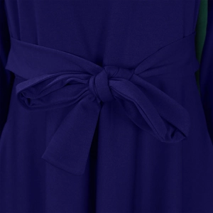 Detail view of the waist area with a dark blue bow tie and fine horizontal texture