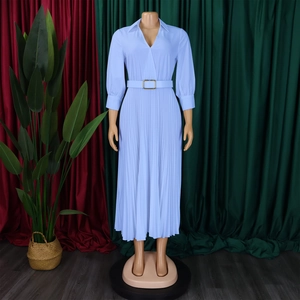 Detail view of light blue V-neck pleated dress with waist belt and metallic buckle