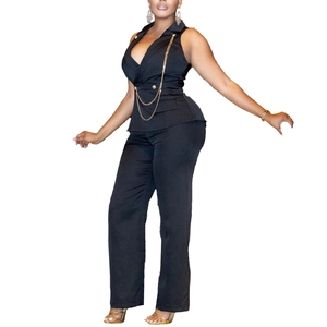 Detail of black V-neck vest and straight-leg pants with decorative gold chain and buttons