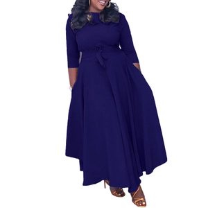 Close-up of elegant navy blue A-line dress with long sleeves and bow belt detail