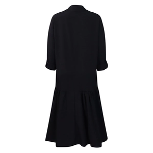 Detailed back view of casual loose black maxi dress with pleated hem and dropped shoulders