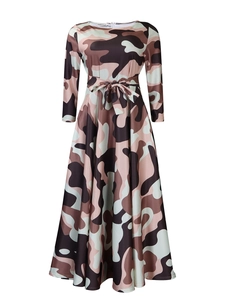 Detail view of the camouflage print dress featuring a waist tie and long sleeves