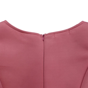 Close-up detail of the elegant neckline and invisible zipper on the solid pink evening dress
