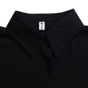 Detail of classic black shirt collar with brand label and fine cotton fabric texture
