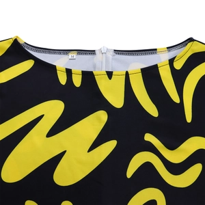Close-up of the round neckline with a white invisible zipper on the African print dress