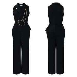 Detail of black peplum jumpsuit featuring gold buttons and double chain belt accessory