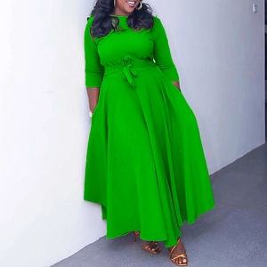Detail of the grass green maxi dress featuring a matching waist tie and A-line silhouette