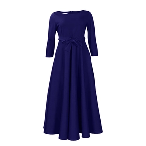 Detail of the high waist tie-knot bow and elegant A-line flare on this navy blue maxi dress