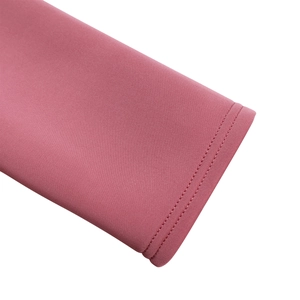 Close-up of pink evening dress sleeve with premium double-needle stitching detail