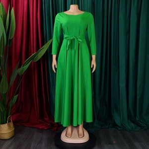 Detailed view of bright green long-sleeve maxi dress featuring a self-tie waist belt