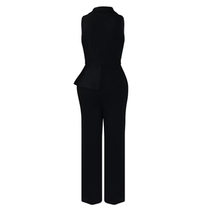 Back view of a black sleeveless wide-leg jumpsuit with asymmetric ruffled waist detail