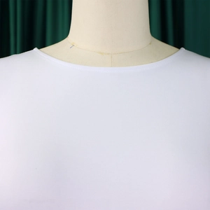 Detailed close-up of the round neckline with fine double-stitch sewing on white dress