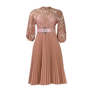 Close-up of elegant mauve lace bodice with lantern sleeves and pleated skirt details