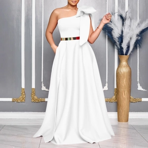 Detail of white one-shoulder evening gown with large bow and elegant gold waist belt