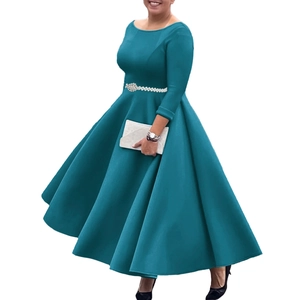Detail of teal long sleeve evening gown featuring a pearl belt and pleated A-line skirt