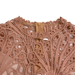 Close-up of pink lace dress high neck with scalloped edges and hidden back zipper