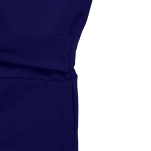Close-up of navy blue ribbed knit fabric showing the waist seam and texture of the dress