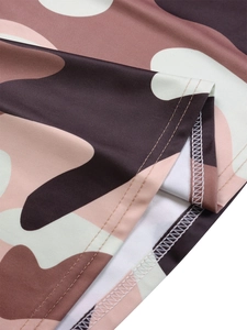 Detailed close-up showing camouflage print knit fabric with durable double-stitch hemline