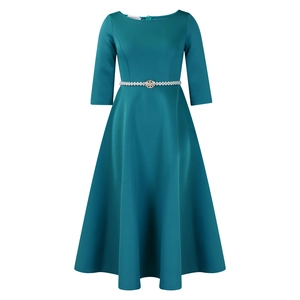 Detail of elegant dark teal girl's gown featuring a pearl and rhinestone waist belt