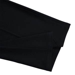 Close-up of fine stitching and high-density black knit fabric texture on jumpsuit cuffs