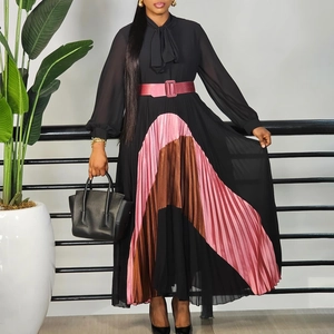 Detail of elegant pleated maxi dress featuring a chic pink and brown V-shaped color block