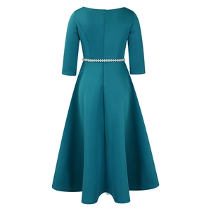 Detailed back view of a teal evening gown featuring a thin silver rhinestone belt on the waist
